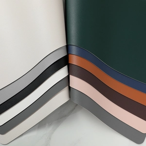 Double-sided leather placemats in multiple colors with elegant lychee texture on marble