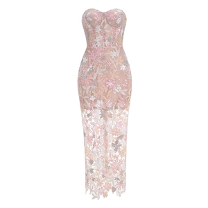 Detail of pink floral embroidery and silver sequins on the sheer champagne evening gown