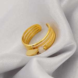 18K gold plated stainless steel open ring with natural stone pendant on silk background