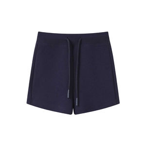 Detail view of dark blue knitted yoga shorts featuring adjustable drawstring waist and texture