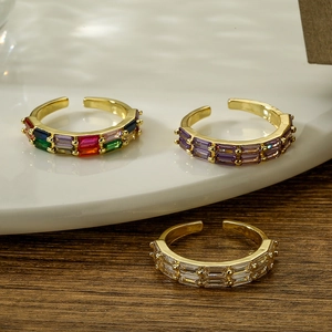 Adjustable gold rings set with rectangular cubic zirconia in purple and white crystals