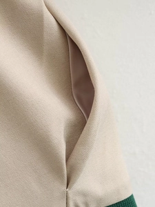 Detailed macro view of side pocket design with high-density twill fabric and contrast ribbing