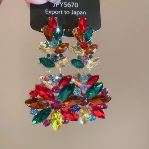 Detailed macro view of colorful marquise crystal flower earrings with gold finish