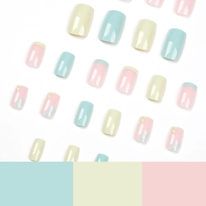 Simple French press-on nails with yellow and blue floral patterns in macaron tones