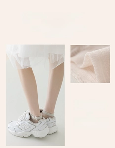 Detail of breathable beige mesh knit socks featuring sweet lace trim and bow accent