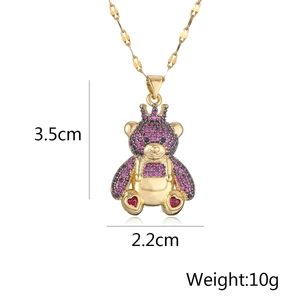 Detail view showing dimensions of a gold-plated bear pendant with purple and pink zircons