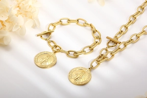 Detail of gold chain necklace and bracelet set with religious coin pendant and toggle clasp