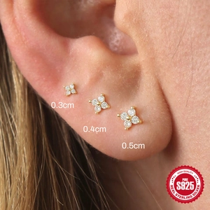 Three sizes of gold S925 sterling silver triangle petal ear studs on earlobe