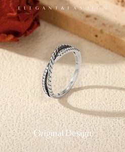Macro view of S925 sterling silver twisted ring with shimmering cubic zirconia stones