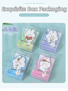 Close-up of four cute cartoon rabbit stress-relief mini notebooks in pastel colors