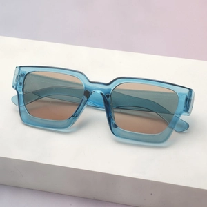 Modern thick square frame sunglasses in transparent teal with gradient lenses