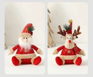 Detail of Santa Claus and reindeer plush dolls with red sequins and soft fur edges