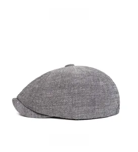 Side view detail of grey newsboy cap showing cotton linen blend fabric texture