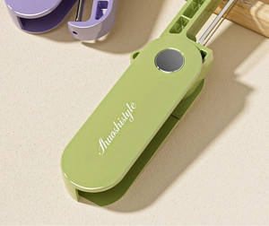 Foldable kitchen peelers in green and purple colors with durable sharp metal blades