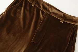 Close-up of brown velvet pants waist with belt loops and high-quality stitching details