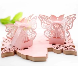 Detail of pink laser-cut butterfly candy box showing flat-packed and assembled state