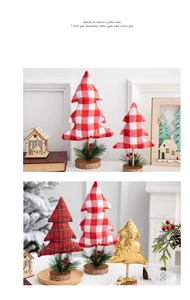Close-up of mini Christmas tree decorations with rustic wood base and plaid fabric details