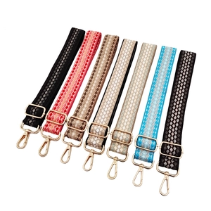 Adjustable woven shoulder straps with gradient patterns and gold metal buckles for handbags