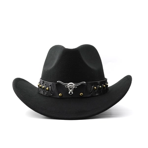 Close-up of a black wool cowboy hat with a leather band and silver bull head metal detail