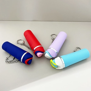 Macro detail of silicone tumbler keychains in blue red purple and light blue with metal rings