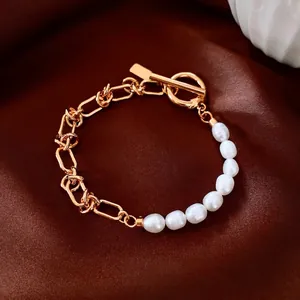 Elegant 18k gold plated asymmetrical bracelet with pearls and OT clasp on silk