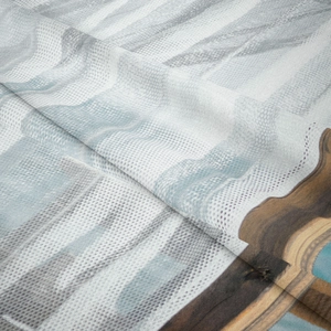 Close-up of bohemian tapestry showing fine woven texture and printed fabric details