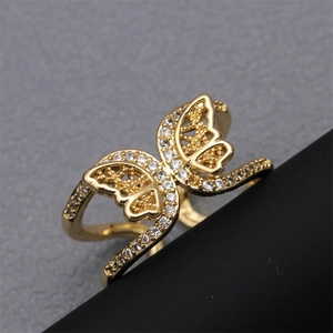 Detail of micro-paved zircon butterfly ring with hollow wings on double-layer band