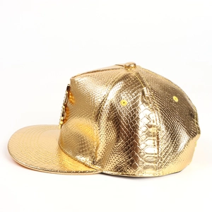 Hip hop gold flat brim hat with embossed snake texture and metallic finish on white background