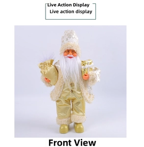 Close-up of Santa Claus figurine in gold luxury suit holding festive gifts for display