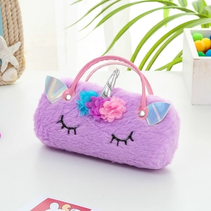 Detail of purple plush unicorn bag with soft faux fur, floral accents and silver horn detail