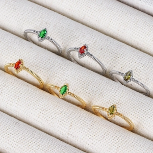 Adjustable 18K gold and silver rings with marquise-cut colorful stones and textured band