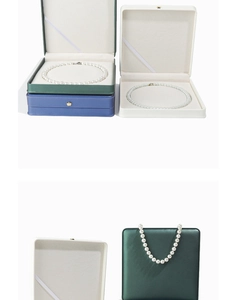 Detail view of premium leather jewelry box for pearl necklaces with small golden crown logo