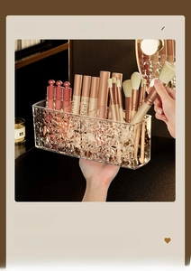 Macro shot of ripple-textured acrylic organizer showing makeup brushes and lipsticks