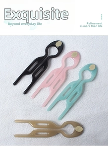 U-shaped hair pins in black, pink, green, and amber resin with gold-tone accents