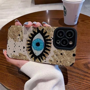 Nordic Evil Eye textured phone case for iPhone with gold glitter and black dots