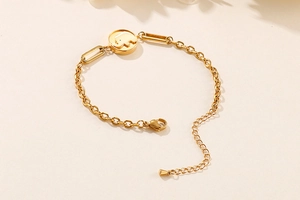 Detail of adjustable gold elephant charm bracelet with lobster clasp and round links