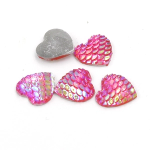 Pink heart-shaped resin cabochons with iridescent scale texture and flat silver back