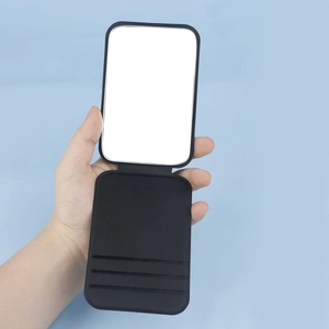 Portable black foldable makeup mirror with PU leather texture and built-in card slots