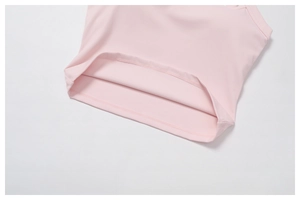 Detailed close-up showing the precise double-stitched hem of the pink yoga tank top