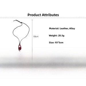 Detail of adjustable black leather cord and dark red oval resin pendant necklace