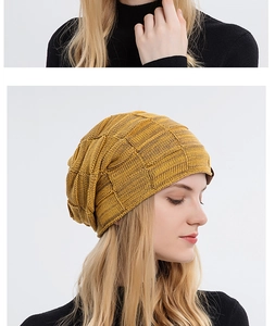 Detail of yellow knit beanie featuring textured checkerboard weave and fleece lining
