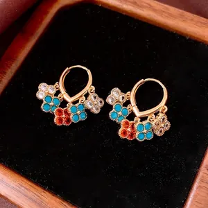 Vintage 18K gold plated flower tassel earrings with colorful zircon stones on black background
