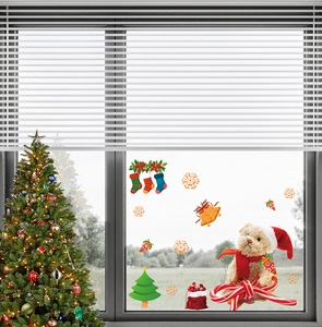 Detailed Christmas window stickers with festive bear, snowflake, and bell motifs