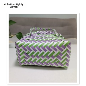 Close-up of the dense weave structure on the purple and green woven basket bag