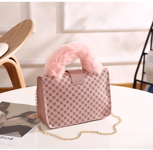 Pink printed leather handbag with plush faux fur handle and gold chain detail