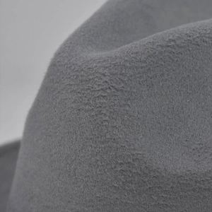 Close-up macro detail of the gray wool felt fabric and texture on the flat top fedora hat
