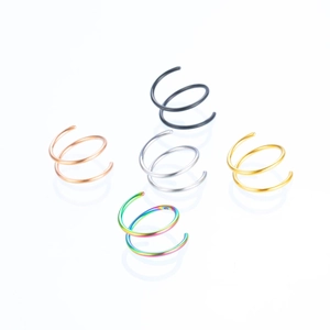 Set of five spiral stainless steel piercing rings in rose gold black silver gold and rainbow