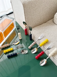 Detail of colorful ceramic beaded handles on 304 stainless steel dessert forks and spoons