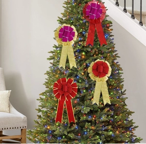Close-up of glitter ribbon Christmas bows in red and gold on a decorated tree