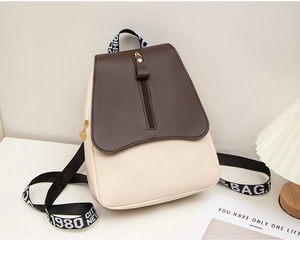 Detail of PU leather backpack with lettered wide straps and vertical zipper design